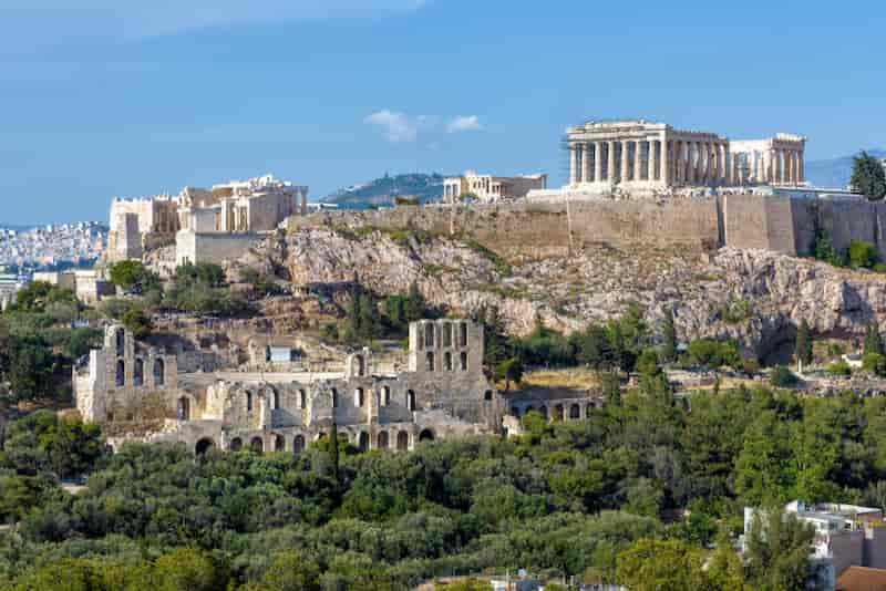Panoramic view of the Acropolis hill with the Parthenon and ancient ruins in Athens, Greece.
